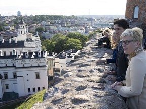 Lithuanian Prime Minister Ingrida Simonyte, Prime Minister Justin Trudeau and Foreign Affairs Minister Melanie Joly take in the view from the Gediminas Castle tower in Vilnius, Lithuania, Monday, July 10, 2023.