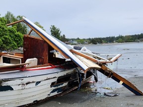 Akoo, a vessel that ran aground and was abandoned on Cadboro Bay beach on March 31, 2023. The owner has been issued a $15,000 fine by the Canadian Coast Guard.