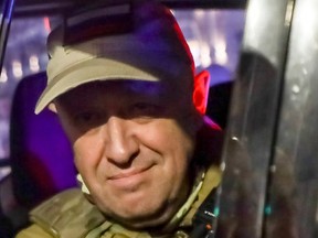 Yevgeny Prigozhin, the owner of the Wagner Group military company, looks out from a military vehicle on a street in Rostov-on-Don, Russia, Saturday, June 24,.