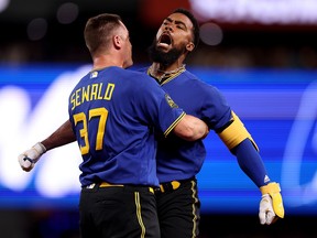 Paul Sewald celebrates a walk-off single by Teoscar Hernandez of the Seattle Mariners against the Toronto Blue Jays at T-Mobile Park on July 21, 2023 in Seattle.