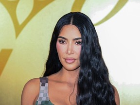 Kim Kardashian poses for a photocall at the Louis Vuitton Menswear Spring-Summer 2024 show as part of the Paris Fashion Week, central Paris, on June 20, 2023.