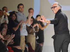 Creative director Joe Mimran walks the runway at the end of the Joe Fresh show during Toronto Fashion Week in Toronto on Wednesday, Oct. 24, 2012. Kit and Ace Technical Apparel Inc. has been bought by a company co-owned by fashion designer and entrepreneur Joe Mimran.