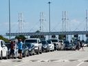 Long lines of people waiting to board a ferry at the  Tsawwassen ferry terminal Saturday, July 1, 2023.