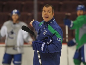 Coach Alain Vigneault directs players during a Canucks practice at Rogers Arena on March 13, 2012.