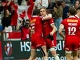 Canada's Jake Thiel is hugged by Alex Russell in a game against Scotland at the 2022 Canada Sevens at B.C. Place Stadium.