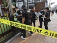 Police officers investigate the scene of a stabbing rampage on a street in Seoul, South Korea, Friday, July 21, 2023.