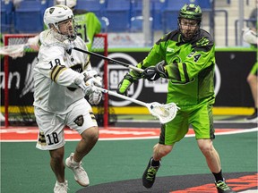 Ryan Dilks of the Saskatchewan Rush battles with Logan Schuss of the Vancouver Warriors during a 2022 game. Dilks signed with Vancouver on Friday as a free agent,