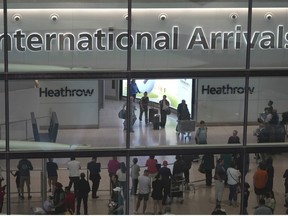 Passengers arrive at the Heathrow Airport, in London Saturday, May 27, 2023.