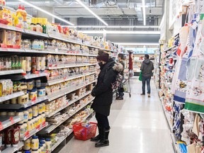 People shop at a grocery store in Montreal.