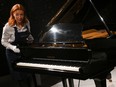 Freddie Mercury's Yamaha G-2 baby grand piano is pictured during a press preview ahead of the "Freddie Mercury: A World of His Own" auctions, at Sotheby's auctioneers in London.