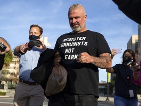 Proud Boys organizer Joseph Biggs walks from the George C. Young Federal Annex Courthouse in Orlando, Fla., on Wednesday, Jan. 20, 2021, after a court hearing regarding his involvement in the storming of the U.S. Capitol on Jan. 6.