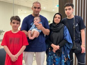 Ahmad Shuja Momuzai, an Afghan interpreter who worked for the Canadian Forces, and his family pose for a photo at the Islamabad airport on June 26, 2023, after escaping the Taliban. From left are Emad, Shuja holding baby Umrah, Zohra and Shahazad. The family is now living in an unfurnished apartment in St. Catharines, Ont.