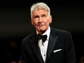 FILE: Harrison Ford stands on stage before being awarded with an Honourary Palme d'or prior to the screening of the film "Indiana Jones and the Dial of Destiny" during the 76th edition of the Cannes Film Festival in Cannes, southern France, on May 18, 2023.
