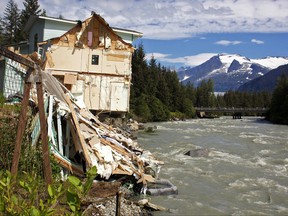 Debris from a home that partially fell into the Mendenhall River sits on its banks in Juneau, Alaska, on Sunday Aug. 6, 2023.