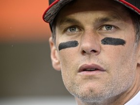 Tampa Bay Buccaneers quarterback Tom Brady stands on the field before an NFL football game against the Cleveland Browns, on Nov. 27, 2022, in Cleveland. Brady has become a minority owner of English second-tier soccer team Birmingham and wants to bring a winning mentality to an underperforming club. The seven-time Super Bowl champion has partnered with the club's holding company, U.S.-based Knighthead Capital Management, and becomes chairman of a new advisory board, Brady and Birmingham said Thursday Aug. 3, 2023.