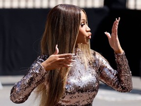 Cardi B gestures as she departs the Fendi runway during the Women's Haute-Couture Fall/Winter 2023/2024 Fashion Week in Paris on July 6, 2023.