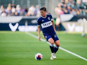 Vancouver Whitecaps midfielder Ryan Gauld (25) surveys the field during the first half of an MLS soccer match against the Los Angeles Galaxy, Sunday, July 30, 2023, in Carson, Calif.