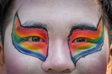 A person's eye makeup is done with rainbows during the Pride Parade at English Bay in Vancouver, B.C., Sunday, Aug. 6, 2023.
