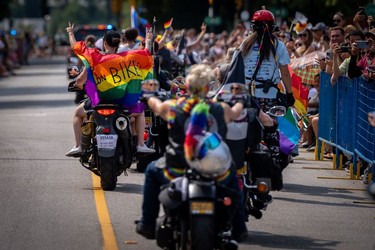 Motorcycle group Dykes on Bikes passes during the Pride Parade at English Bay in Vancouver, B.C., Sunday, Aug. 6, 2023.