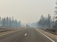 This photo provided by WSDOT East (Washington State of Transportation) smoke from wildfires fill the sky at Salnave/SR 902 interchange in Spokane County, Wash., on Saturday, Aug. 19, 2023.