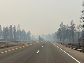 This photo provided by WSDOT East (Washington State of Transportation) smoke from wildfires fill the sky at Salnave/SR 902 interchange in Spokane County, Wash., on Saturday, Aug. 19, 2023.