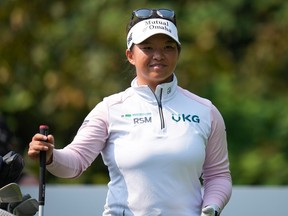 Megan Khang, of the U.S., smiles before hitting her tee shot on the second hole during the final round at the LPGA CPKC Canadian Women's Open golf tournament, in Vancouver, on Sunday, August 27, 2023.