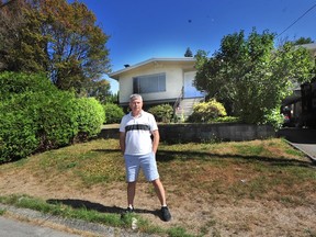 Ian Dowdall in front of his 'orphaned' detached home, which will soon be surrounded by contruction. His hopes to sell to the developer were dashed after the city changed a road alignment.