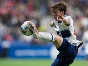 Vancouver Whitecaps' Ryan Gauld scored twice against the Portland Timbers Saturday Aug. 26, 2023. In this file photo, he knocks the ball out of the air with his foot against the Seattle Sounders in 2021.