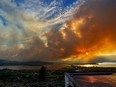 The Eagle Bluff wildfire is seen burning from Anarchist Mountain, outside of Osoyoos, B.C., in a Saturday, July 29, 2023, handout photo. All evacuation orders have now been lifted around the southern British Columbia community that saw a wildfire burn to its doorstep late last month as flames swept north across the border from Washington state.THE CANADIAN PRESS/HO-Melissa Genberg, *MANDATORY CREDIT*