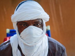 Boubacar Moussa, a former member of the Jama'at Nusrat al-Islam wal-Muslimin group, linked to al-Qaida, poses for a photo in Niamey, Niger, Tuesday, Aug. 1, 2023. The 47-year-old says Niger's coup will embolden violence, increase recruitment across the country and threaten regional stability.