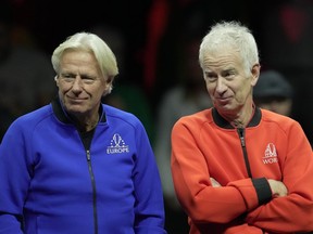Team Europe's Captain Bjorn Borg, left, chats with Team World's captain John McEnroe, on the second day of the Laver Cup tennis tournament at the O2 in London, Saturday, Sept. 24, 2022. Members of Team Europe say they're looking for redemption this week in Vancouver after losing the tournament for the first time last year.