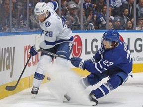 Ian Cole of the Tampa Bay Lightning battles for the puck against Matthew Knies of the Toronto Maple Leafs in Game Two of the First Round of the 2023 Stanley Cup Playoffs in Toronto. Cole has a good sense of what made the Vancouver Canucks tick offensively, both from playing against the likes of Elias Pettersson, J.T. Miller and Quinn Hughes, and from his teammates with top-end offensive talent.