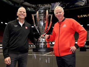 Laver Cup CEO Steve Zacks, left, and Team World vice-captain Patrick McEnroe pose with the trophy during a first look at Rogers Arena on Sept. 18.