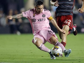 Lionel Messi of Inter Miami takes a shot during the first half during a match between Toronto FC and Inter Miami CF at DRV PNK Stadium on Sept. 20, 2023 in Fort Lauderdale, Fla.
