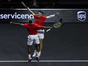 Ben Shelton and Frances Tiafoe of Team World react to match point in their doubles match after defeating Andrey Rublev of Team Europe and Hubert Hurkacz of Team Europe to win the Laver Cup for Team World during day three of the Laver Cup at Rogers Arena on Sept. 24, 2023 in Vancouver.