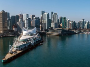 File photo: The Vancouver skyline and cruise ship terminal, left on Wednesday, March 22, 2023.