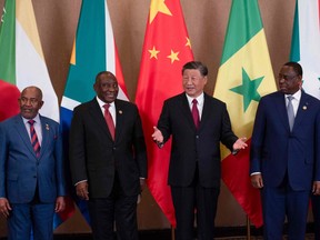 From left, Comoros President Azali Assouman, South African President Cyril Ramaphosa, Chinese President Xi Jinping and Senegalese President Macky Sall attend the China-Africa Leaders' Roundtable Dialogue on the last day of the 2023 BRICS Summit in Johannesburg on Aug. 24.