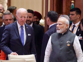 U.S. President Joe Biden and India's Prime Minister Narendra Modi arrive for the opening session of the G20 Leaders' Summit in New Delhi on September 9, 2023.
