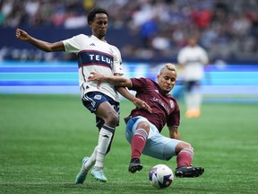 Vancouver Whitecaps' Ali Ahmed battles with Colorado Rapids' Michael Barrios during their meeting at B.C. Place earlier this year. Ahmed, now recovered from a concussion, has been called up to represent Canada. He'll join the team after Wednesday's game against Colorado.