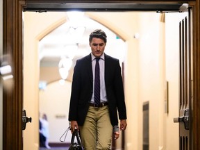 Prime Minister Justin Trudeau walks to make a statement to reporters after Speaker of the House of Commons Anthony Rota, not shown, accepted responsibility for honouring a man who fought with a Nazi unit at the Parliamentary address from Ukrainian President Volodymyr Zelenskyy, on Monday, Sept. 25, 2023. THE CANADIAN PRESS/Justin Tang