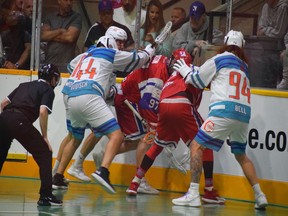 Members of the Six Nations Chiefs and New Westminster Salmonbellies battle for a loose ball in Game 3 of the Mann Cup Monday at Queen's Park Arena. Six Nations carries a 3-0 lead into Game 4 tonight and can clinch the Canadian title.