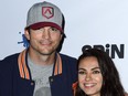 Ashton Kutcher and Mila Kunis pictured at Dodger Stadium in 2018.