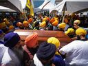 Despite images of Canadian Sikh protesters outraged at India, observers say the Sikh population is “not monolithic” on Khalistan or other issues. (Photo: Surrey mourners carry the casket of slain Khalistani activist Hardeep Singh Nijjar on June 25, 2023.)