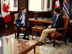 Prime Minister Justin Trudeau meets with Premier of British Columbia David Eby, left, in his office on Parliament Hill in Ottawa, on Monday, Sept. 25, 2023.