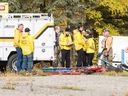 Prince George Search and Rescue crews prepare their gear in a staging area at Purden Lake Resort near the site of a helicopter crash, east of Prince George, B.C., on Tuesday, Sept. 26, 2023.