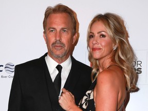 Kevin Costner and Christine Baumgartner at the AARP Movies for Grownups Awards Gala in 2015.