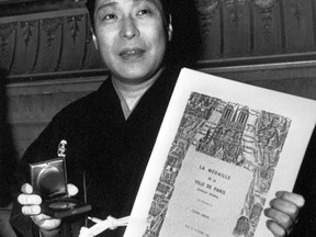 FILE - Ichikawa Ennnosuke, director and actor of Japanese Kabuki traditional theater, is awarded the Paris city vermeil medal by a city hall official at the Chatelet Theater following a performance, Oct. 16, 1987, in Paris. Ichikawa, who revived the spectacular in Japanese Kabuki theater like "flying" supported by ropes, to woo younger and global audiences, has died Wednesday, Sept. 13, 2023.