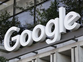 The Google sign is shown over an entrance to the company's new building in New York on Wednesday, Sept. 6, 2023. The U.S. government is taking aim at what has been an indomitable empire: Google's ubiquitous search engine and the lucrative digital services hatched by its unwavering status as the internet's main gateway.