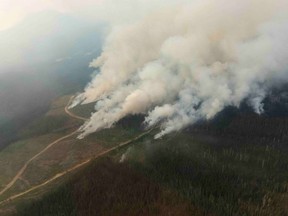 Gusty winds and unsettled weather in parts of British Columbia helped kick up several wildfires over the weekend, forcing a number of evacuation orders and alerts. Four regional districts, from the Sunshine Coast to the Cariboo, central Okanagan and Peace River, issued or upgraded evacuation orders between Friday and Sunday. Fires burn near Big Creek, B.C., in a handout file photo.