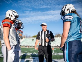 The coin toss at the first ever FATE (Female Athletes Tackling Excellence) football game in Saskatoon, Sept. 26, 2023. Knowing which side is up before the toss could be useful.